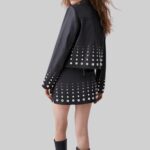 Back view of the stylish-black studded leather jacket for women's