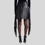 Black leather fringe skirt-back view, highlighting its sleek design