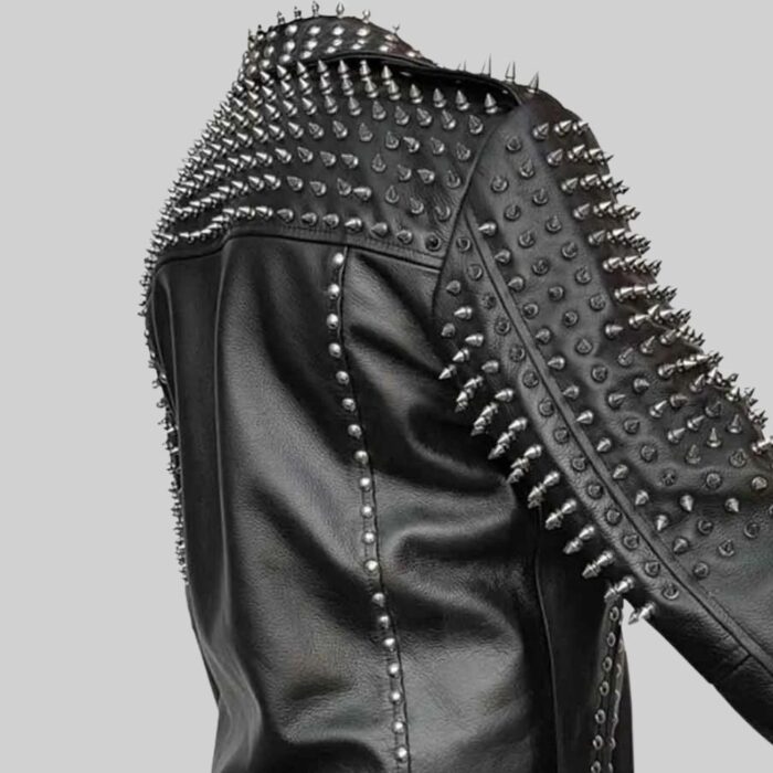 Closeup of studded detailing on the side of the-black leather jacket