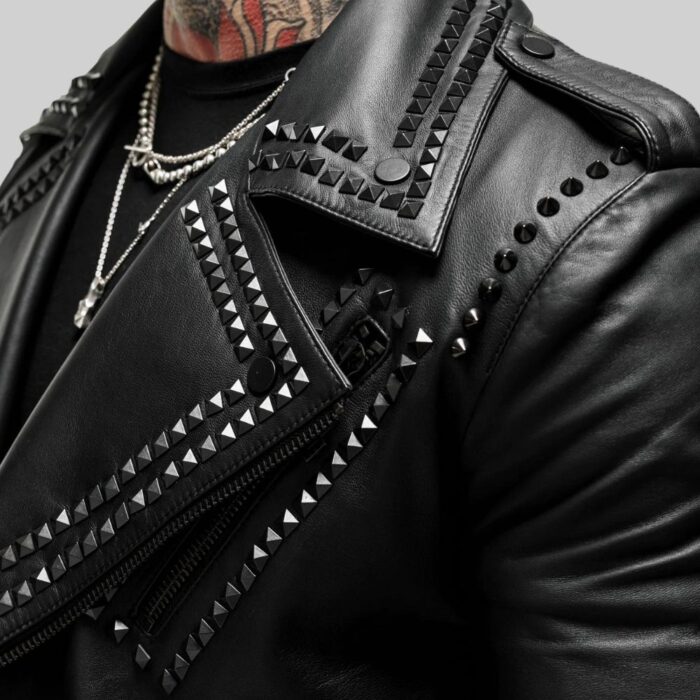 Closeup of the stud detailing on the side of the-leather biker jacket