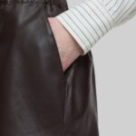 Closeup of the pocket on-brown leather women's shorts