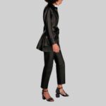 Profile view of a stylish-short leather trench coat