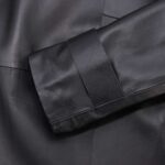 Women's black leather coat-sleeve closeup