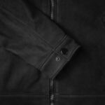 Close-up of the-black leather jacket cuff for men, highlighting the zipper and fine stitching.