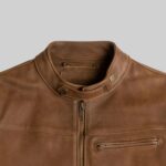 Closeup of the collar detail on a-men's brown leather outerwear