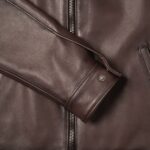 Closeup of the cuff on-men's dark brown leather outerwear