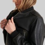 Detailed side shot of-women's cropped leather bomber jacket