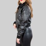 Side view of a fashionable-black crop bomber jacket for women