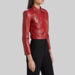 Side view of-red crop leather moto jacket on model