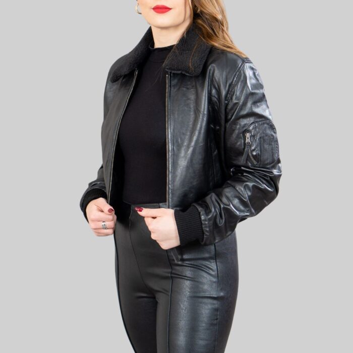 Third front view of a fashionable-women's black crop bomber jacket